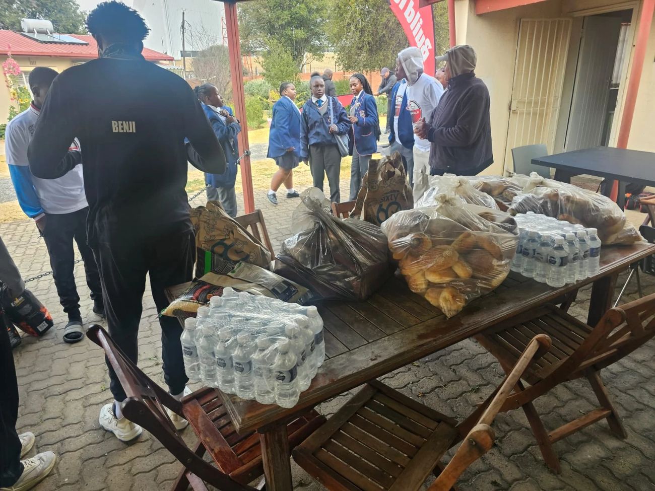 Volunteers preparing food and supplies for the community